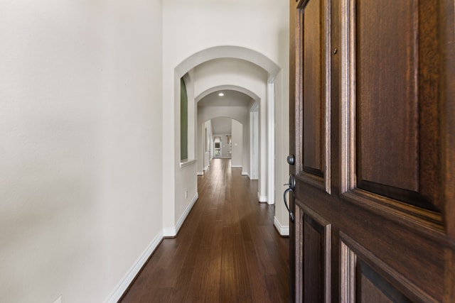 hallway featuring dark hardwood / wood-style flooring