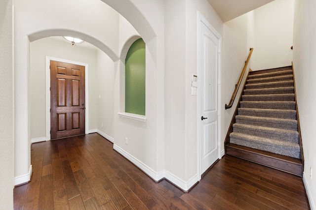 foyer with dark wood-type flooring