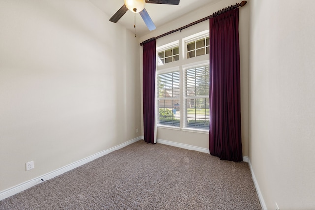 unfurnished room featuring ceiling fan and light colored carpet