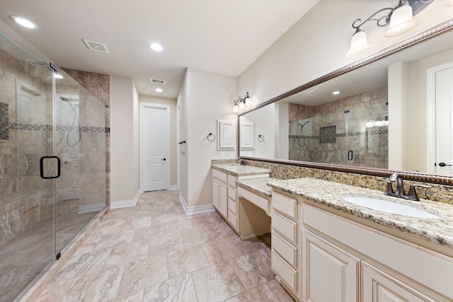 bathroom featuring an enclosed shower and vanity