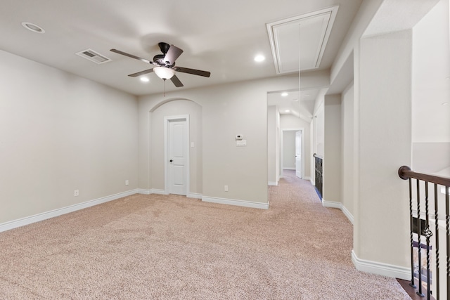 carpeted empty room featuring ceiling fan