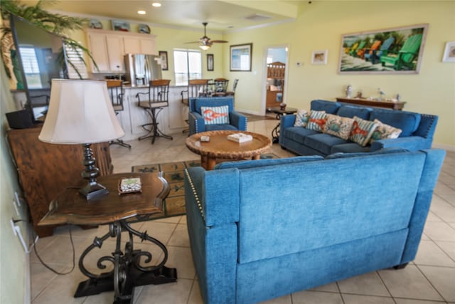 tiled living room with ceiling fan