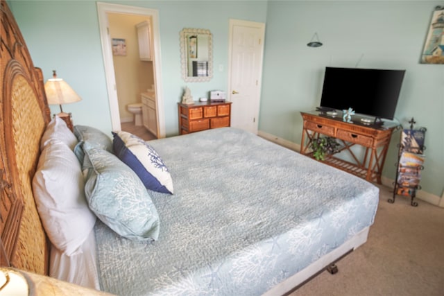 carpeted bedroom with ensuite bathroom