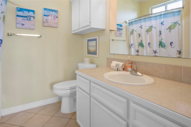 bathroom featuring a shower with shower curtain, tile patterned flooring, vanity, and toilet