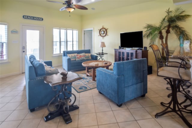 tiled living room featuring ceiling fan