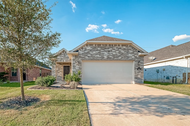 view of front of home with a garage and a front yard