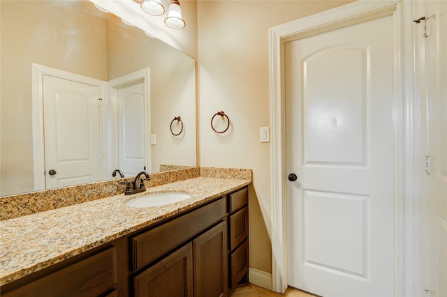 bathroom with vanity and tile patterned flooring