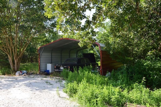 exterior space with a carport