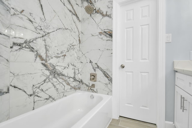 bathroom featuring wood-type flooring, vanity, and bathing tub / shower combination