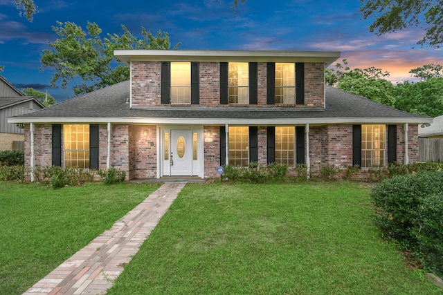 view of front of home with a lawn