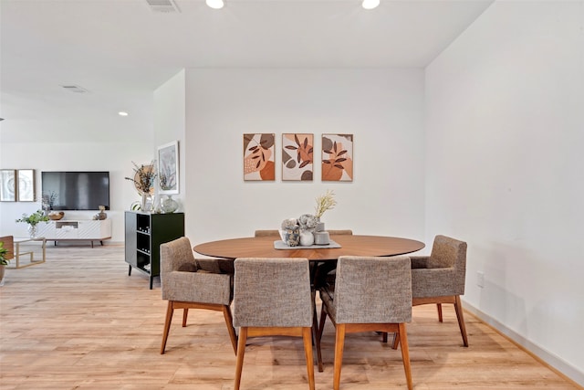 dining room with light hardwood / wood-style flooring