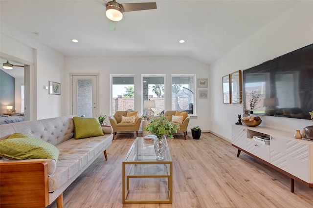 living room featuring light wood-type flooring, lofted ceiling, and ceiling fan