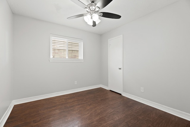 spare room featuring ceiling fan and dark hardwood / wood-style flooring