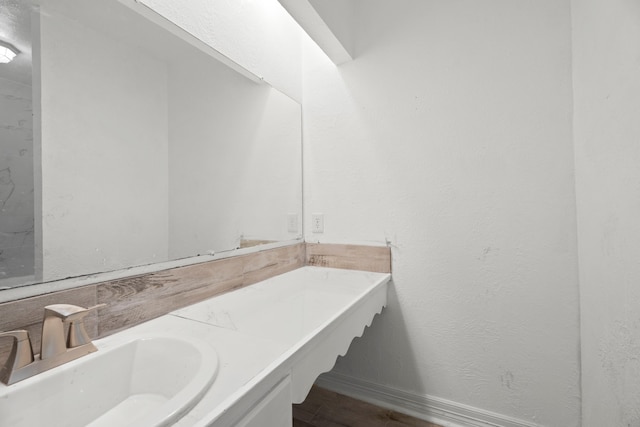 bathroom with hardwood / wood-style floors and vanity