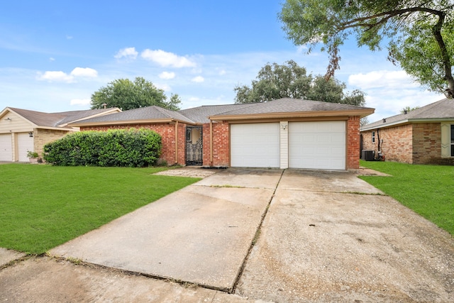 single story home with a garage and a front yard