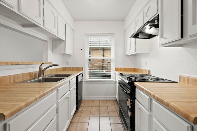 kitchen with white cabinets, black appliances, light tile patterned flooring, and sink