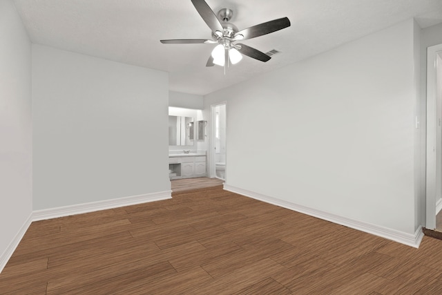 unfurnished room with wood-type flooring and ceiling fan