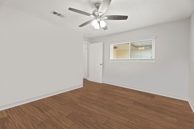 empty room with ceiling fan and wood-type flooring