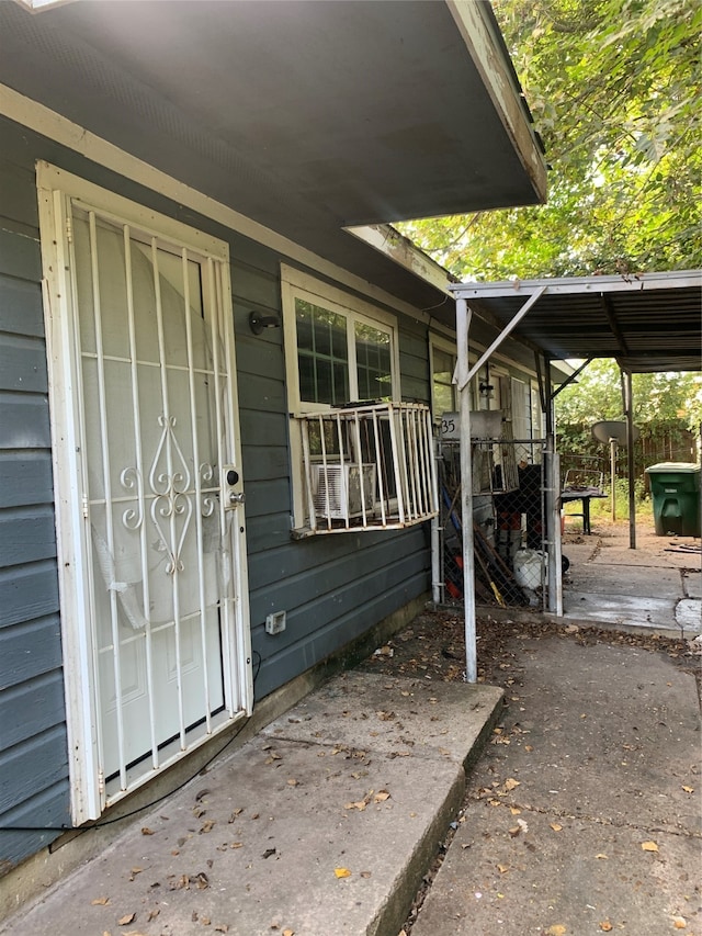 entrance to property with a patio