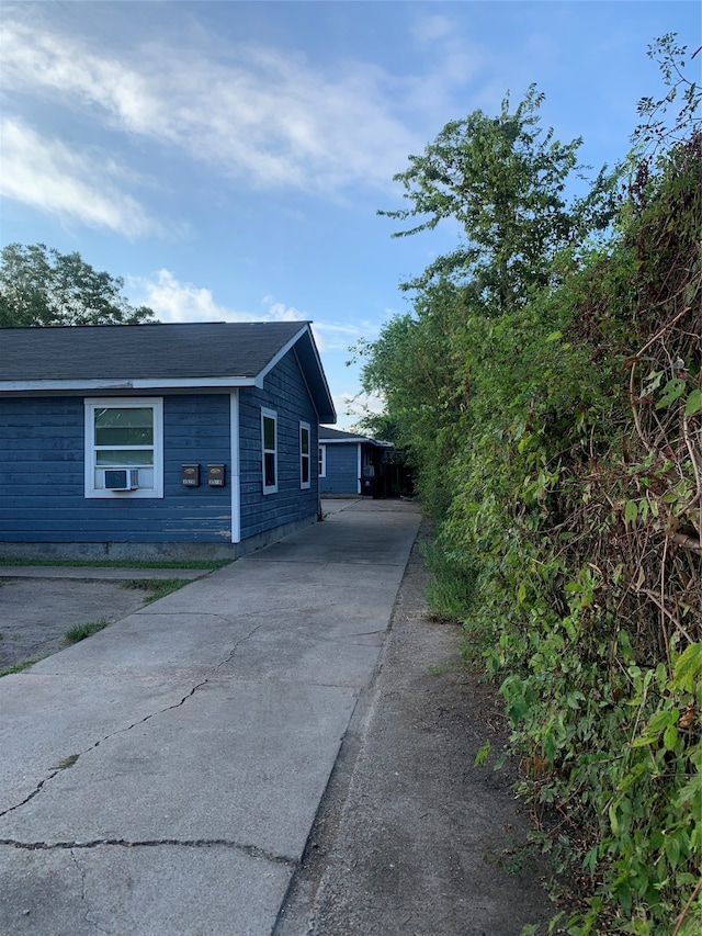 view of front of home featuring cooling unit