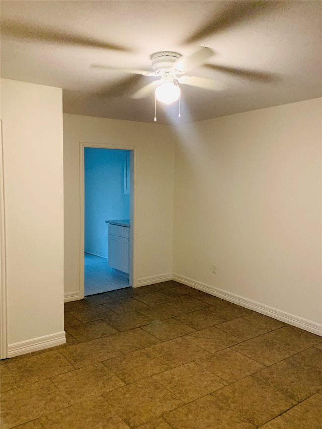 unfurnished room with ceiling fan