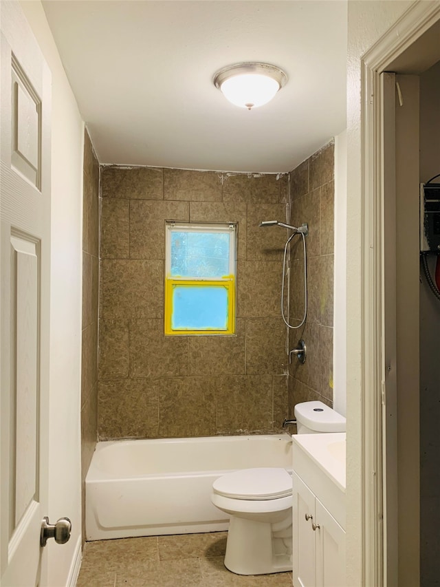 full bathroom with tiled shower / bath, vanity, tile patterned flooring, and toilet