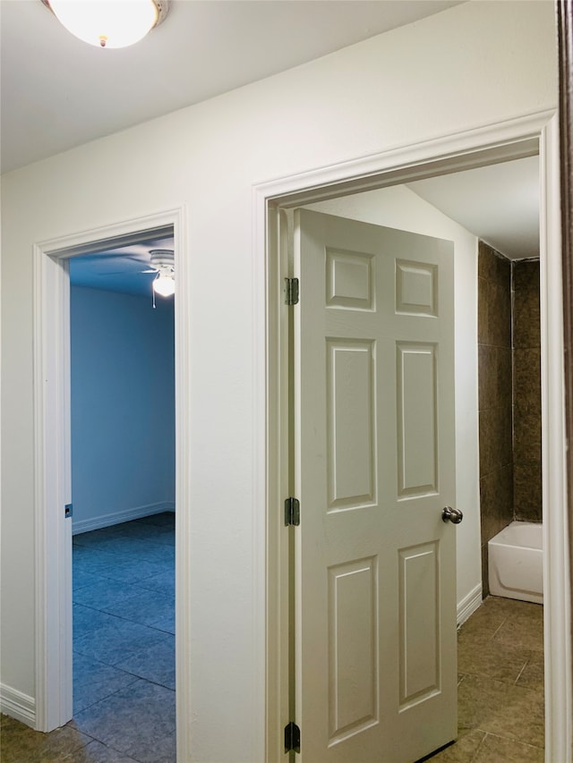 corridor featuring light tile patterned flooring