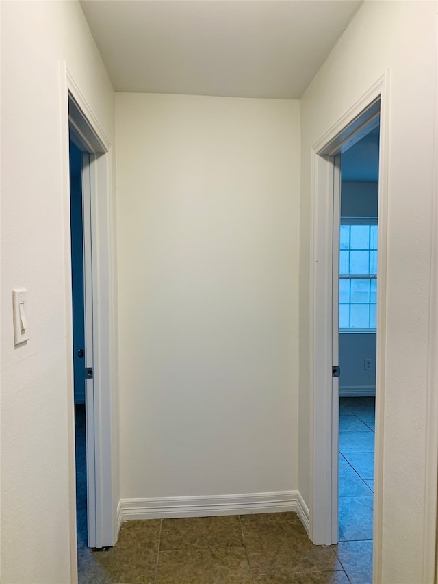 hall with tile patterned flooring