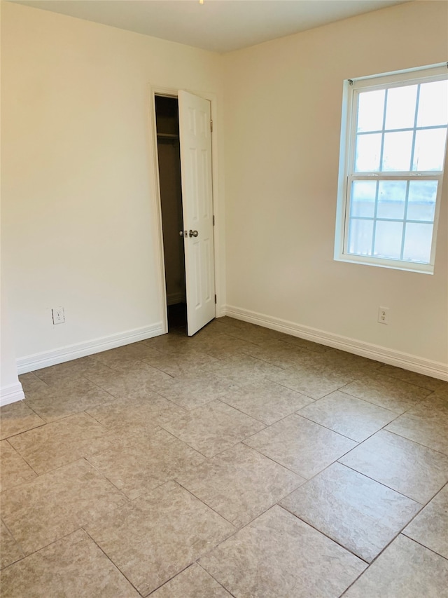 view of tiled spare room