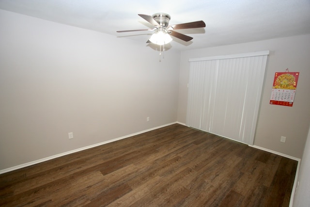 unfurnished bedroom with dark hardwood / wood-style floors and ceiling fan