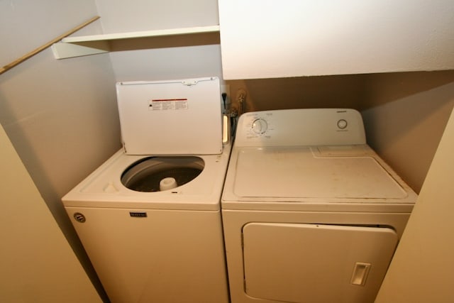 washroom featuring washer and dryer