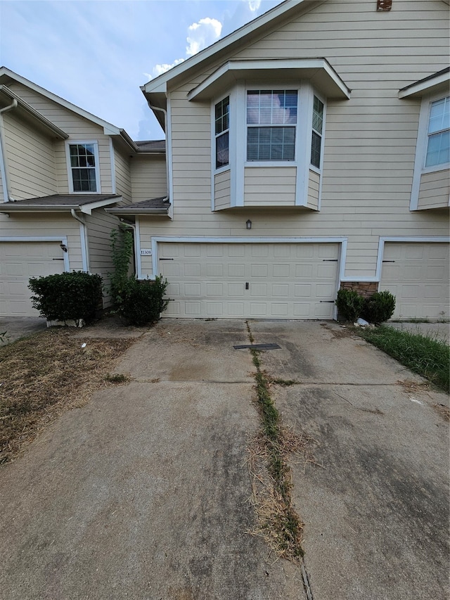 view of side of home featuring a garage