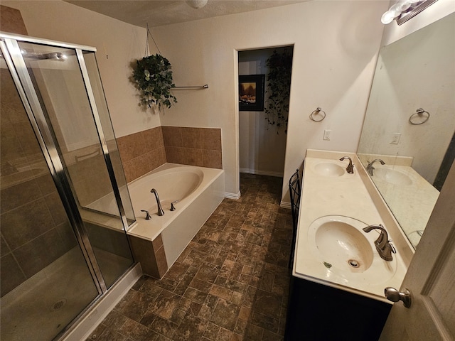 bathroom featuring independent shower and bath and vanity