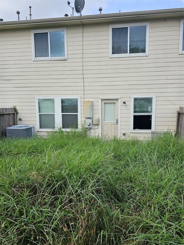 back of property with central air condition unit