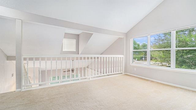 interior space featuring lofted ceiling and carpet