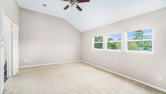 interior space with lofted ceiling, light carpet, and ceiling fan