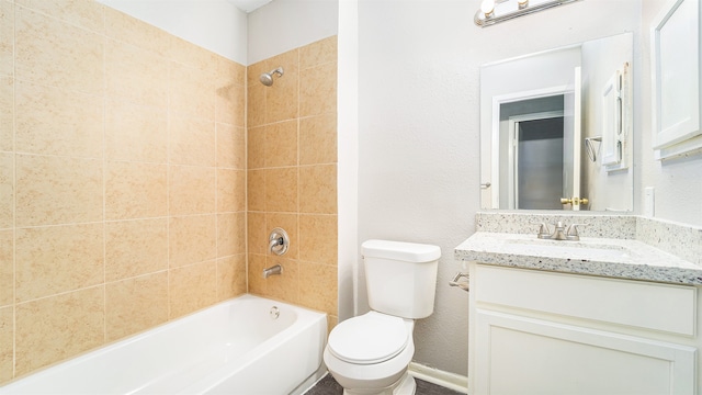 full bathroom featuring vanity, toilet, and tiled shower / bath