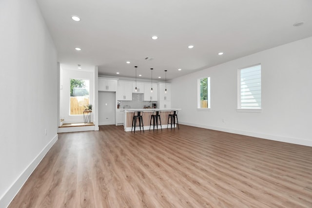 unfurnished living room featuring light hardwood / wood-style floors