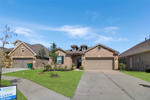 view of front of home with a garage and a front lawn