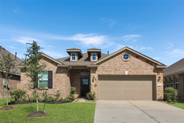 craftsman house with a front lawn and a garage