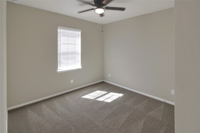 spare room featuring carpet floors and ceiling fan