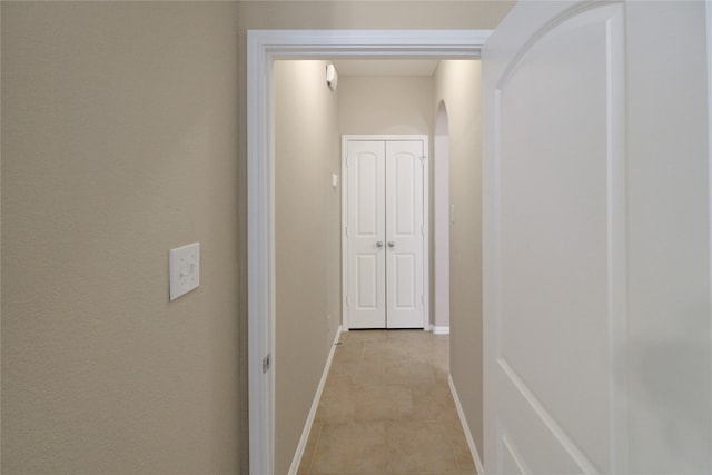 hall with light tile patterned flooring