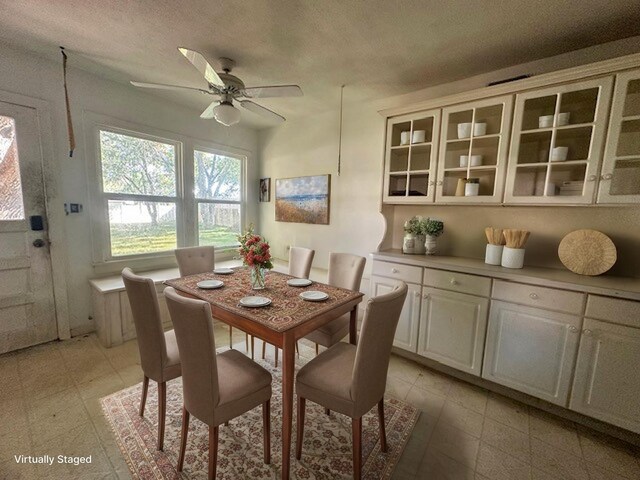 515 Breezy Ln, Wharton, TX 77488 - dining room featuring a ceiling fan and a textured ceiling