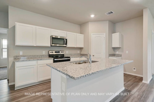 kitchen featuring appliances with stainless steel finishes, sink, and white cabinets