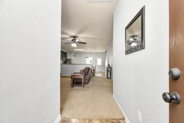 hallway with light carpet