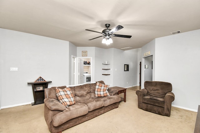 carpeted living room featuring ceiling fan