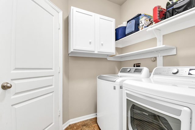 laundry area featuring cabinets and washing machine and dryer