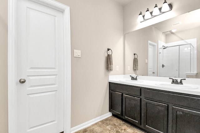 bathroom with walk in shower and vanity