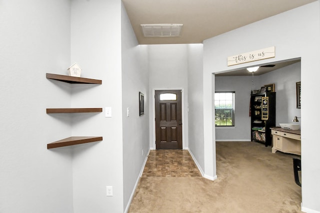 foyer with light carpet