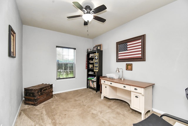 carpeted office featuring ceiling fan